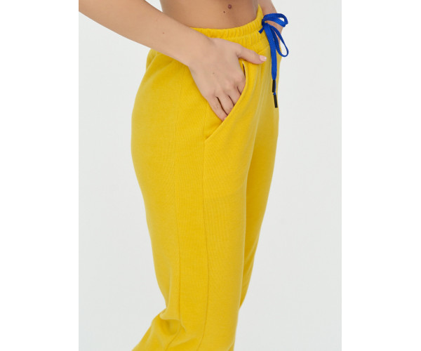 Спортивные брюки женские желтого цвета 1307J