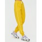 Спортивные брюки женские желтого цвета 1306J