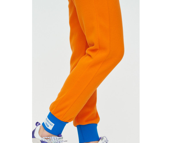 Спортивные брюки женские оранжевого цвета 1307O